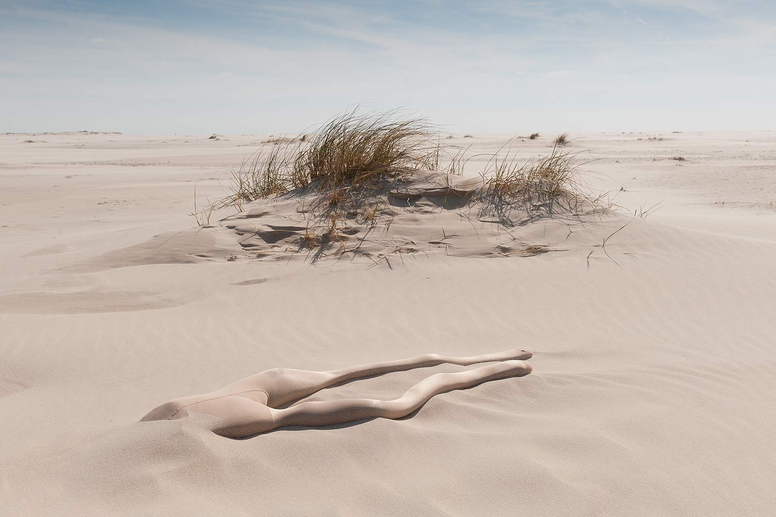 Site-specific temporary sculpture with sand-filled nylon tights on the Kniepsand of the German North Sea island of Amrum
