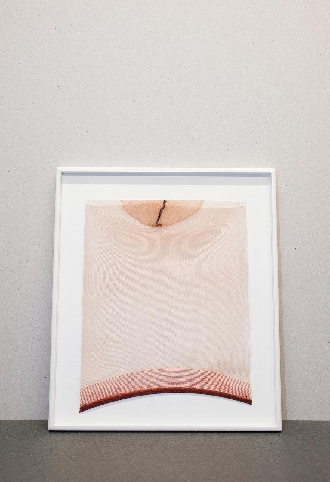 A rectangular shape was cut from a polyamide sock with cured epoxy resin and mounted on a handmade wooden object frame