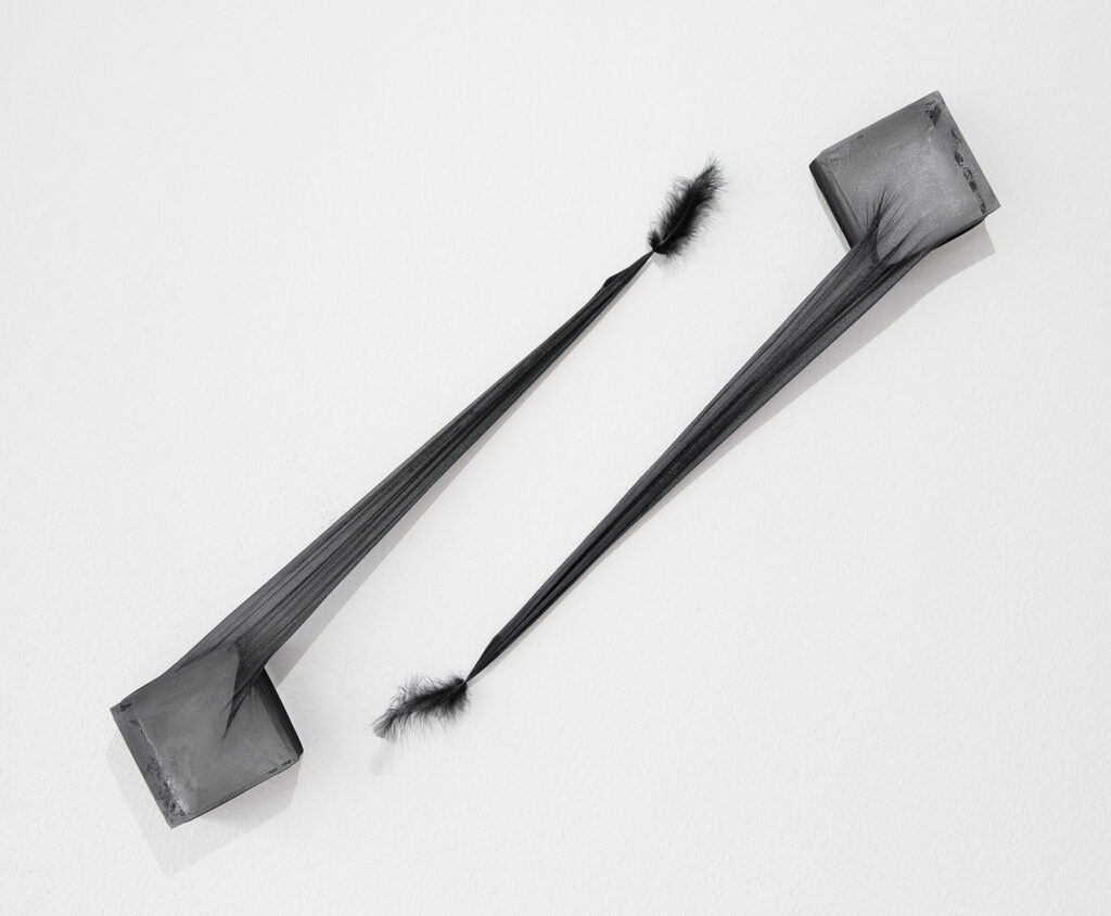 Two art objects made from stretched black polyamide stockings, epoxy resin and marabou feathers.